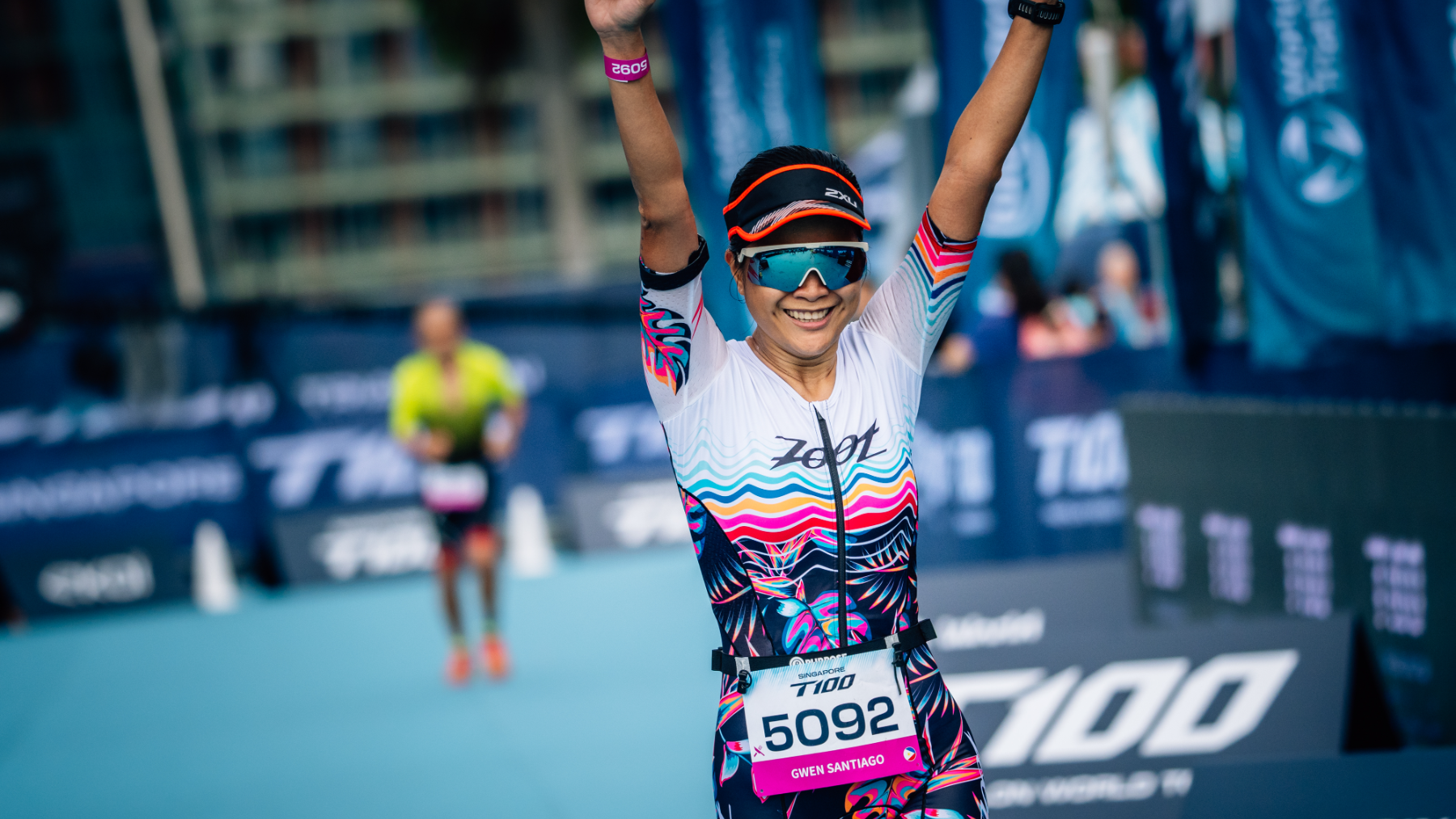 Athlete crossing the finish line at the Singapore T100 Triathlon 2024